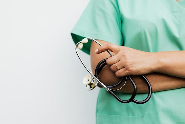 a healthcare professional holding a stethoscope